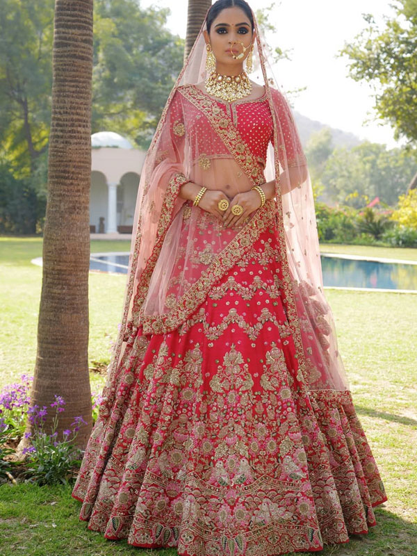 red bridal lehenga with pink dupatta