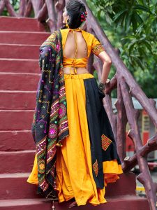 Raas Yellow & Black Colour Resham Embroidered & Tassels Work Navratri Lehenga Choli