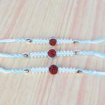 Three Rudraksha with Tiny Pearl Beads Rakhi