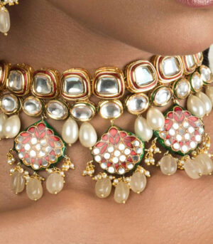 Pristine Enamelled Red And Off White Kundan Necklace And Earring Set